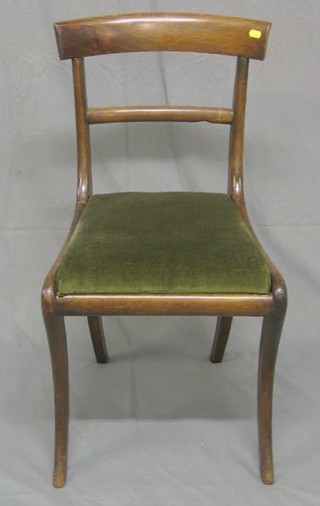 A set of 4 Georgian mahogany bar back dining chairs with plain mid rails on sabre supports (old worm marks to frame)