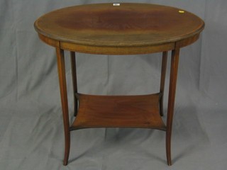 An Edwardian oval inlaid mahogany 2 tier occasional table raised on tapered supports 30"