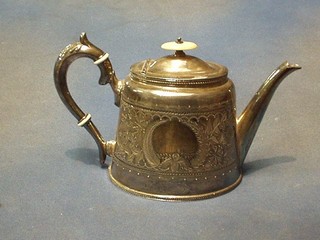 An oval Britannia metal teapot with engraved decoration