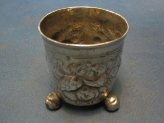 An Antique embossed silver goblet decorated fruit, raised on 3 bun feet, marked entwined HH,