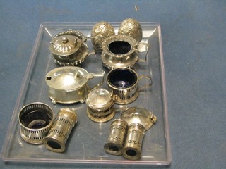 A pair of Indian embossed silver salts raised on bun feet, a pair of Victorian silver mustard pots (f), 3 various silver mustard pots (2f), a pierced silver salt and 3 cylindrical pepperettes
