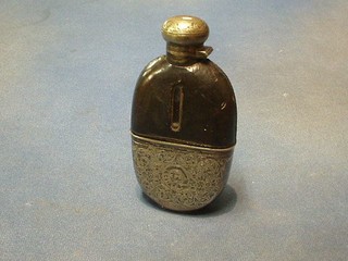 An Edwardian cut glass hip flask with detachable silver plated cup