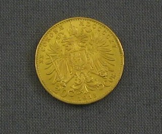 A 1915 Austrian gold coin, the edge impressed (20c)