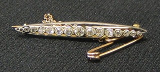 A 19th Century gold marquise shaped bar brooch set 15 diamonds