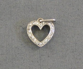 A white gold heart shaped pendant, set numerous diamonds