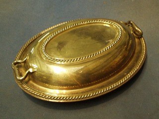 An oval silver plated entree dish and cover with gadrooned decoration