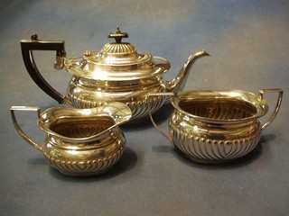 An oval 3 piece silver plated tea service comprising teapot, sugar bowl and cream jug with demi-reeded decoration