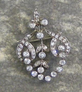 A lady's Victorian gold pendant/brooch set 55 diamonds