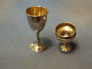 A silver goblet with parcel gilt interior Birmingham 1933, 5", a small silver goblet 2", silver napkin ring and a silver hair tidy lid 2"