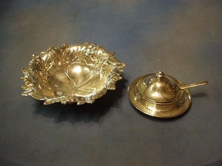 An embossed silver plated leaf shaped bowl, raised on 4 bun feet 8" and a circular hotelware butter dish 5"