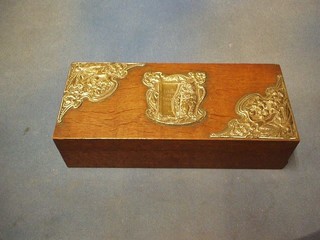 An Edwardian rectangular oak trinket box with hinged lid and embossed silver mounts, the centre decorated an owl and marked Ashton on Mersey 1910, mounts Birmingham 1904, 11"