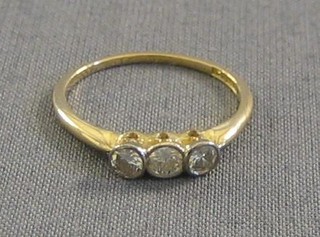 A lady's 18ct gold dress/engagement ring set 3 diamonds