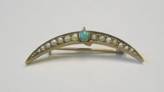 A lady's Edwardian 9ct gold crescent shaped brooch set demi-pearls and turquoise