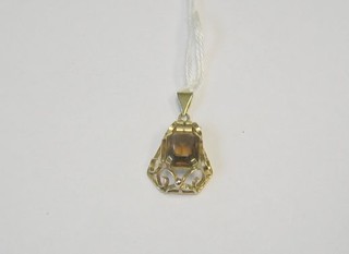 A 9ct gold pierced pendant set a rectangular cut tormaline?