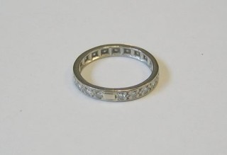 A lady's 18ct white gold or platinum eternity ring set diamonds