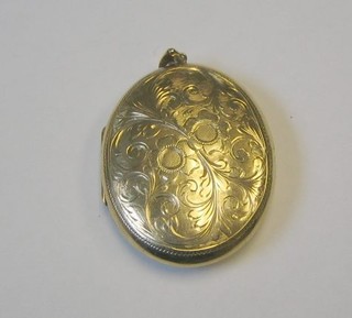 A 9ct engraved gold locket