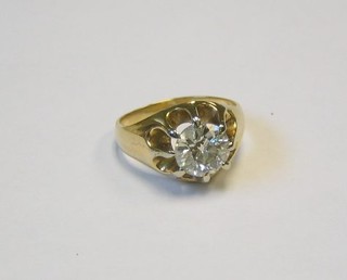 A tested gold gypsy ring set a large brilliant cut diamond