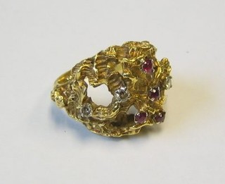 An Eastern high carat pierced gold dress ring set diamonds and rubies