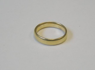 A gold wedding band marked Brinks