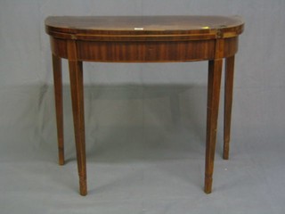 A Georgian inlaid mahogany demi-lune card table raised on square tapering supports 36" (requires some attention)