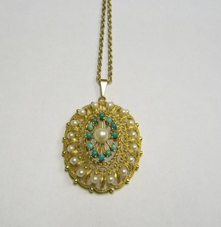 A 9ct gold pierced gold pendant set demi-pearls and turquoise hung on a fine gold chain