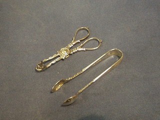 A pair of Edwardian silver sugar tongs, Sheffield 1902 and a pair of silver plated ice tongs