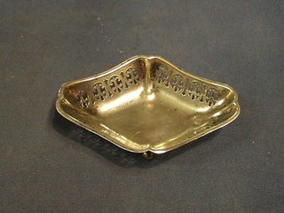 A shaped pierced silver bowl raised on 3 bun feet Birmingham 1934 5"