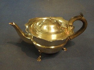 A circular silver bachelor's teapot raised on 3 hoof supports, Birmingham 1915 11 ozs