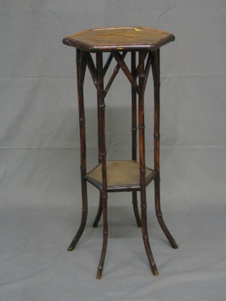 A 19th/20th Century octagonal bamboo 2 tier jardiniere stand, 15"