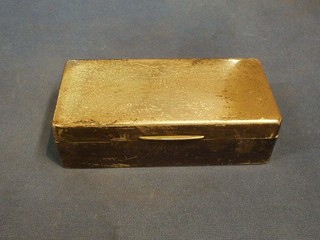 A plain rectangular silver cigarette box with hinged lid 7"