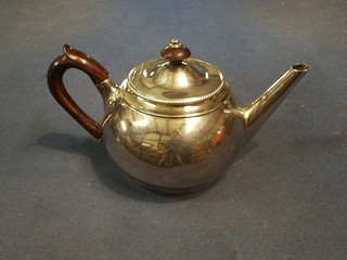 A George III plain silver melon shaped teapot with bead work border and rosewood handle, London 1801, makers mark RS, London 1801, 16 ozs