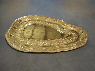 An Eastern embossed "silver" tray in the form of an oasis 15 1/2" 16ozs