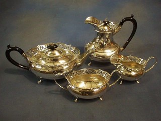 A 4 piece oval silver plated tea service with pierced borders teapot, hotwater jug, sugar bowl and cream jug
