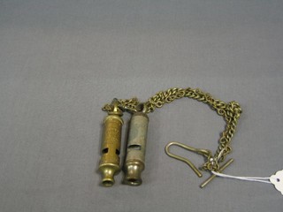 A Metropolitan Police whistle and a City Police and Fire whistle