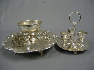 A circular embossed silver plated bowl 11", a silver plated spirit burner, sugar bowl, egg cruet and a gilt metal box