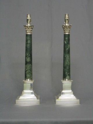 A pair of large and impressive stepped silver plated table lamps with Corinthian columns