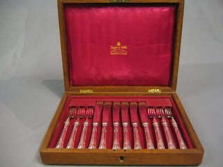 A cased set of 6 19th Century silver plated fish knives and forks by Mappin & Webb contained in an oak canteen box