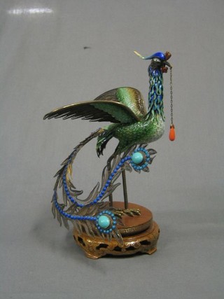 A fine quality 20th Century Oriental pierced silver and enamelled figure of a standing fabulous bird, raised on a hardwood stand 9"