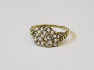 A gold dress ring in the form of entwined hearts set demi-pearls and diamonds