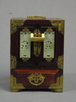 An Oriental Eastern hardwood jewellery case with brass banding 6"