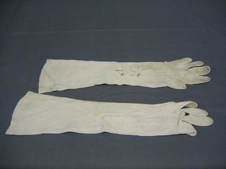A pair of ladies long kid skin gloves