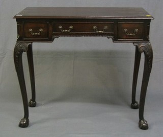 A 19th Century mahogany side table/low boy fitted 1 long drawer flanked by 2 short drawers, raised on carved cabriole ball and claw supports 32"