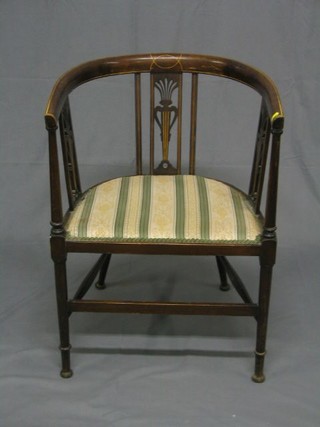 An Edwardian inlaid mahogany tub back chair with pierced slat back, raised on turned supports