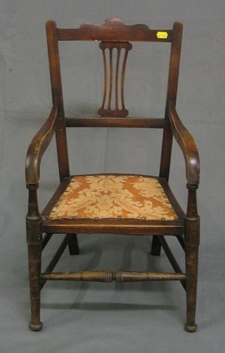 An Edwardian mahogany bar back childs chair with pierced slat back and upholstered seat on turned supports