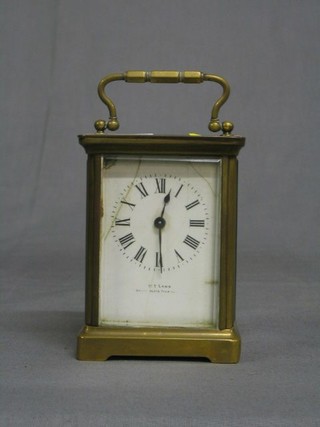A French 19th Century carriage clock with enamelled dial and Roman numerals, marked T W Lamb