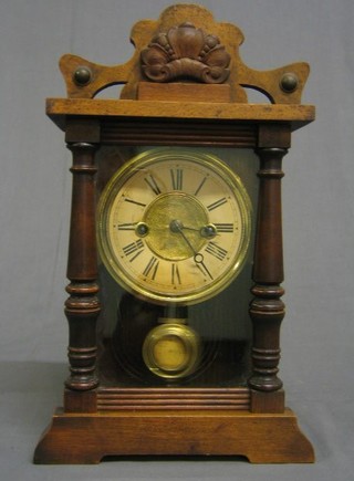 A 19th Century 8 day American striking shelf  clock contained in a walnutwood case