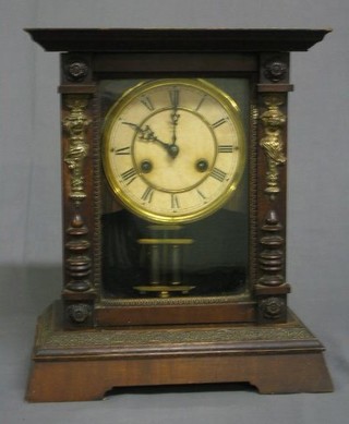 A 19th Century American  8 day striking shelf clock contained in a walnutwood case with gilt metal mounts