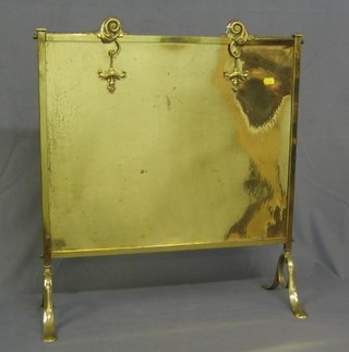 A brass fire screen