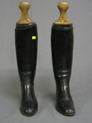 A pair of black leather riding boots, size 7 by Tom Hill of Knightsbridge, together with a pair of wooden boot trees by Alkit Service & Sporting Outfitters Cambridge Circus