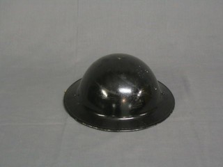 A WWII black steel  helmet